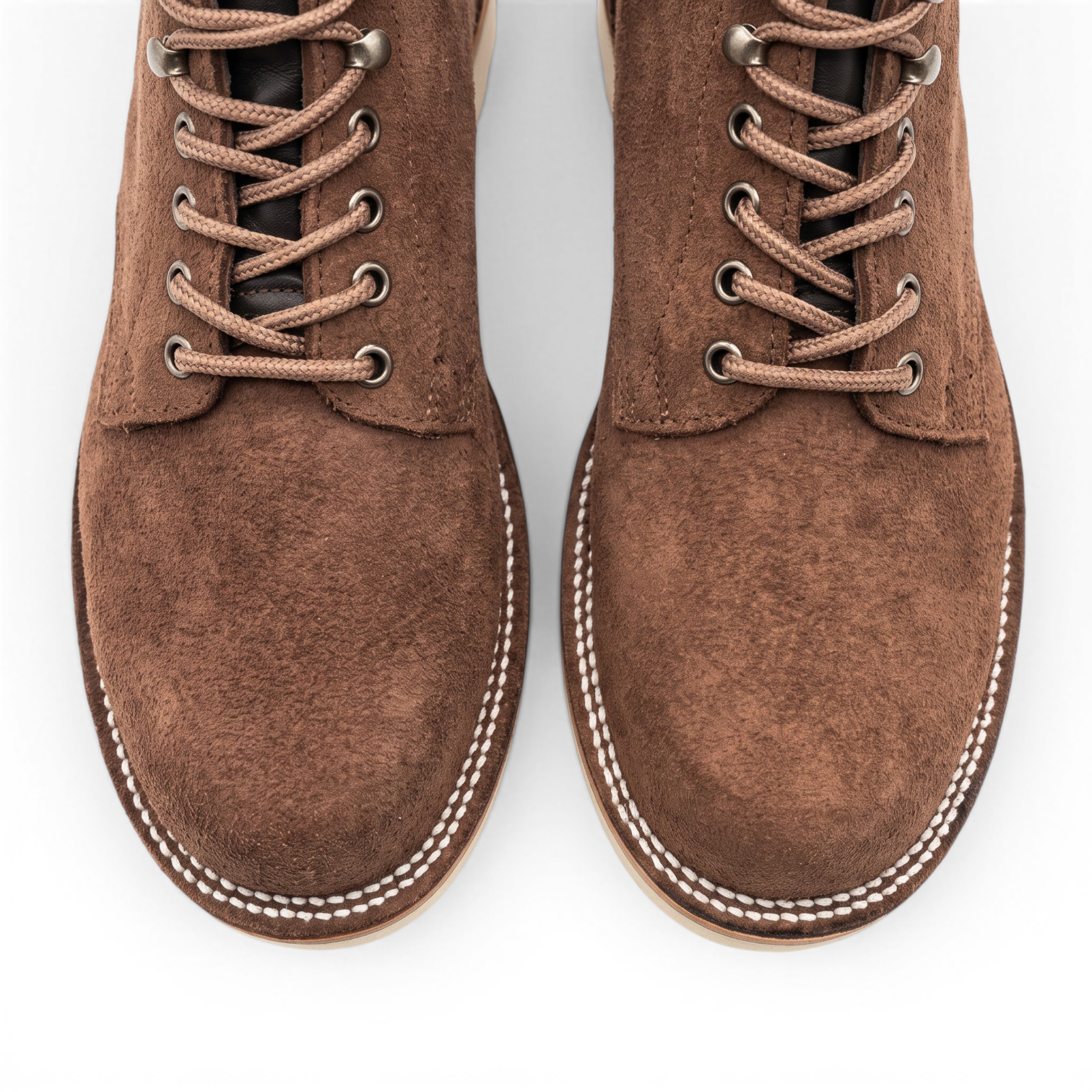 A pair of brown suede lace-up boots shown from a top-down view on a clean white background.