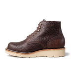 A dark brown textured leather lace-up ankle boot with a thick beige sole, shown in a side profile on a white background.